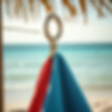 Innovative beach hook in use, keeping towels tidy