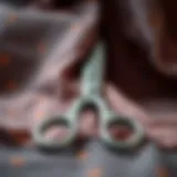 Close-up of sharp fabric scissors on a vibrant fabric background