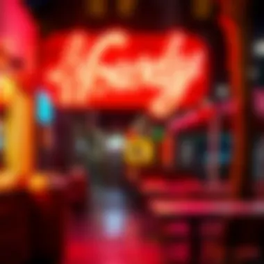 An outdoor setting featuring a Howdy neon sign at night
