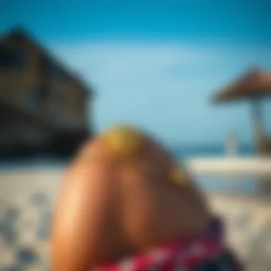 An individual wearing a sun belly button ring at a beach setting, emphasizing personal style