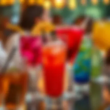 Clear plastic cocktail glasses filled with vibrant beverages at a gathering