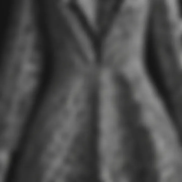 Close-up of intricate fabric patterns in a black and white dress