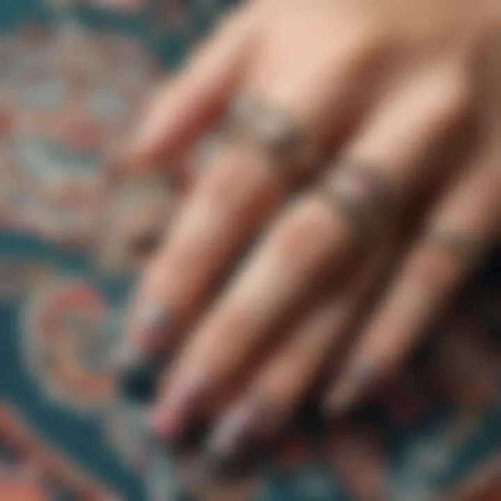 Close-up of a beautifully manicured nail with bohemian stickers