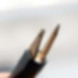 Detailed view of a double ended cuticle pusher showcasing its dual tips.