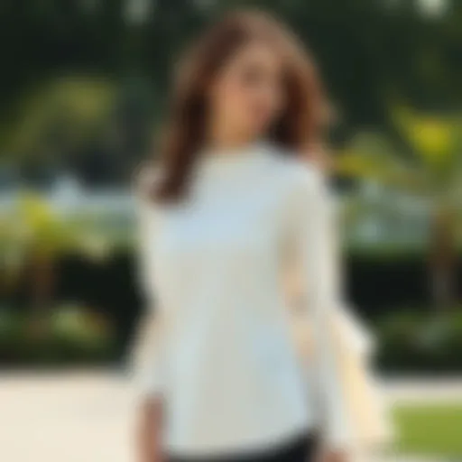 Elegant white blouse featuring bell sleeves in a serene outdoor setting