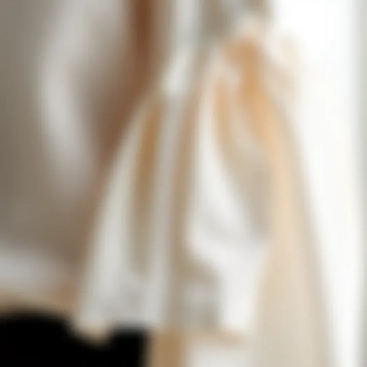 Close-up of intricate fabric detailing on a white bell sleeve blouse