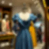 Elegance of the Jean Blue Dress A stylish jean blue dress displayed elegantly on a mannequin.