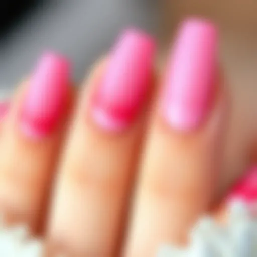 A close-up of beautifully crafted pink ombre glue-on nails showcasing intricate designs.