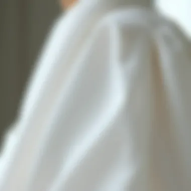 Close-up of fabric texture and design details of a white blouse